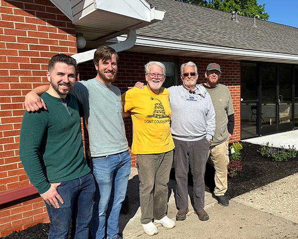 Men outside Church